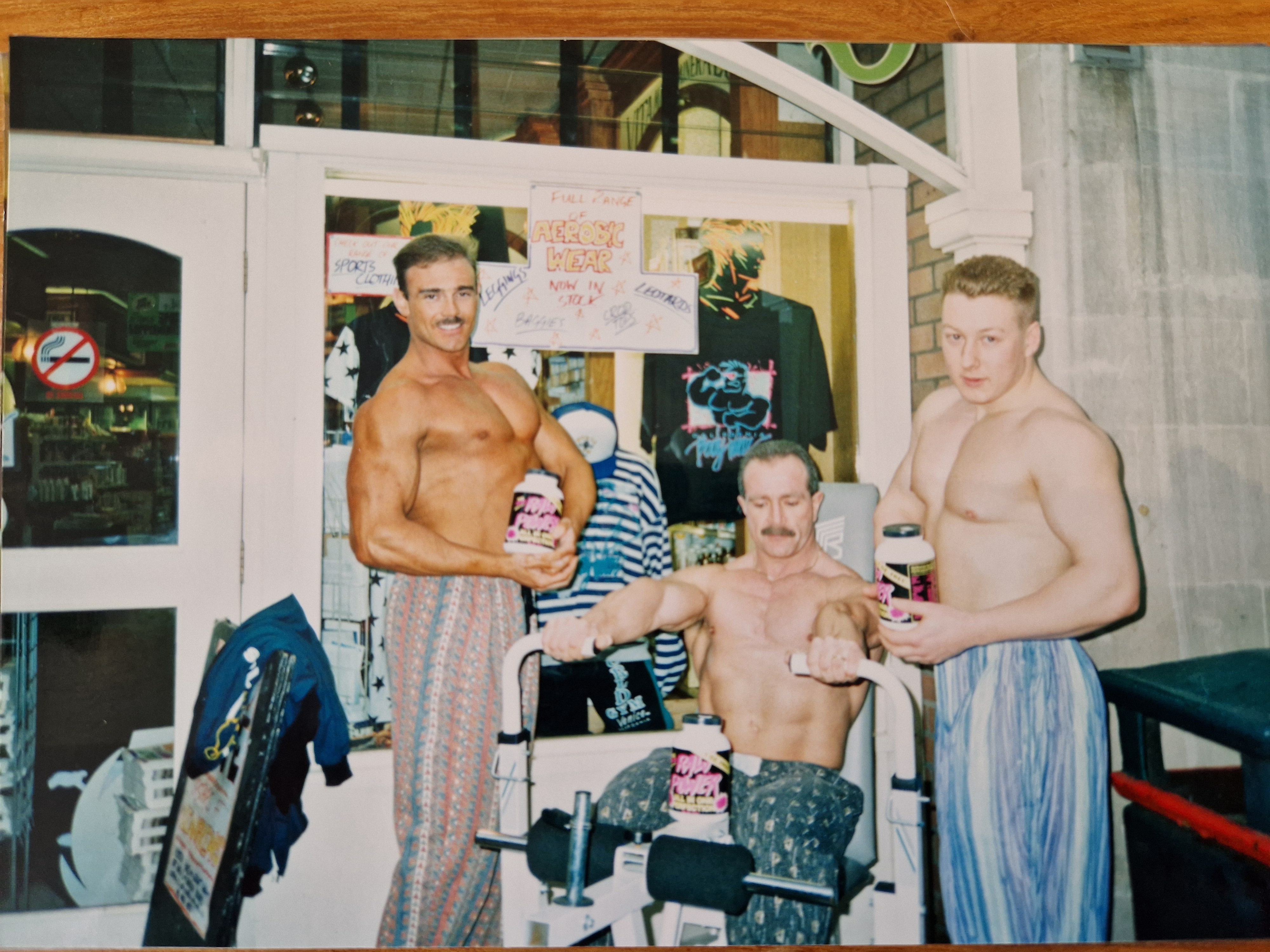 Natural Bodybuilders showing off their muscles and the baggy pants of the day.